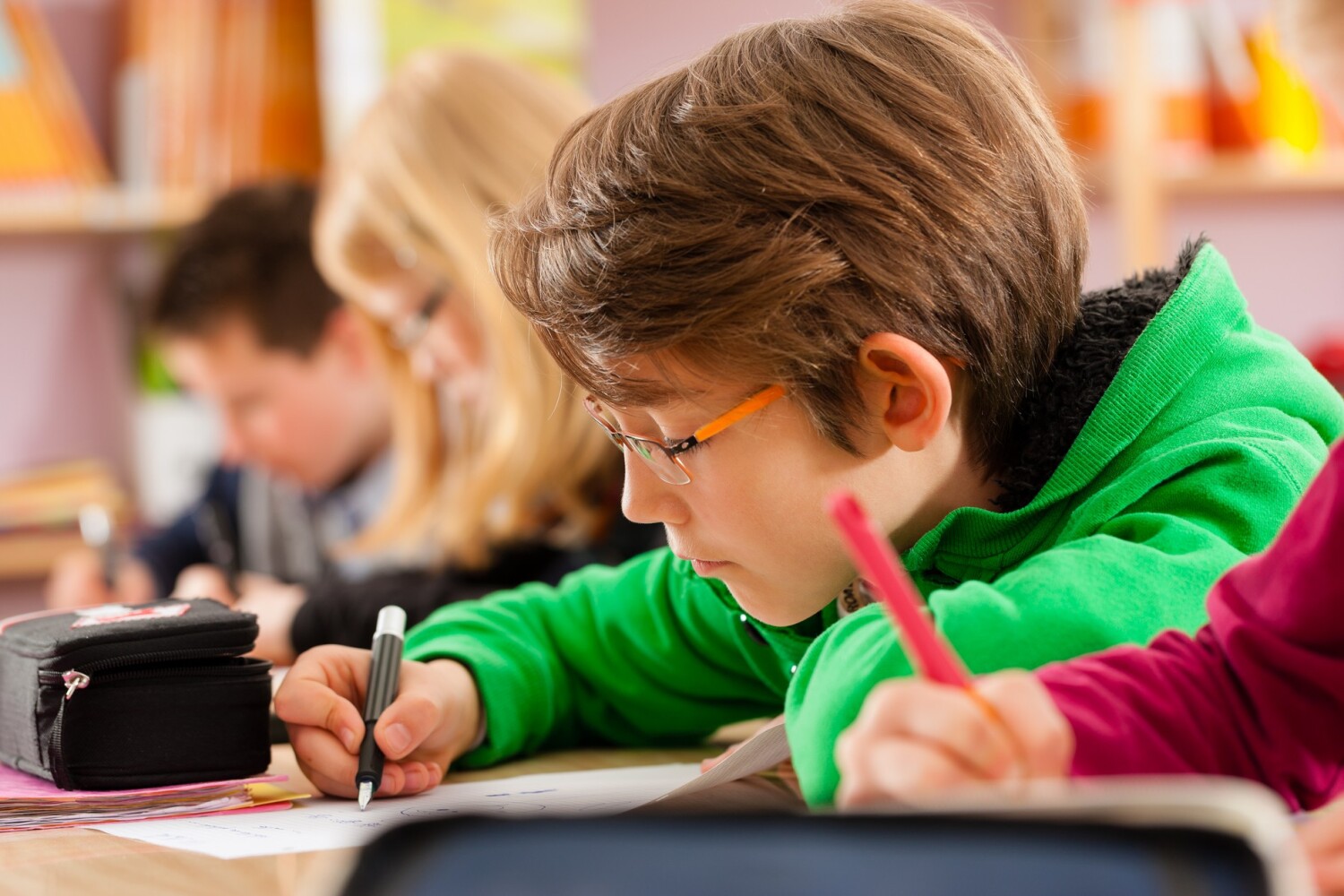 Education - Pupils at primary or elementary school doing their homework or having a school test